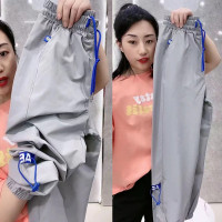 大尺碼300斤2023夏季薄款冰絲速乾運動褲束腳男胖寬鬆九分休閒褲