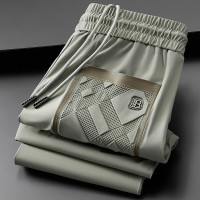 輕奢夏季薄款冰絲滑彈力休閒運動褲男修身高端歐貨小腳九分褲男士