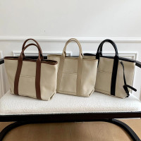 百搭休闲帆布手提托特包包女2024新款韩版超大容量单肩斜挎水桶包